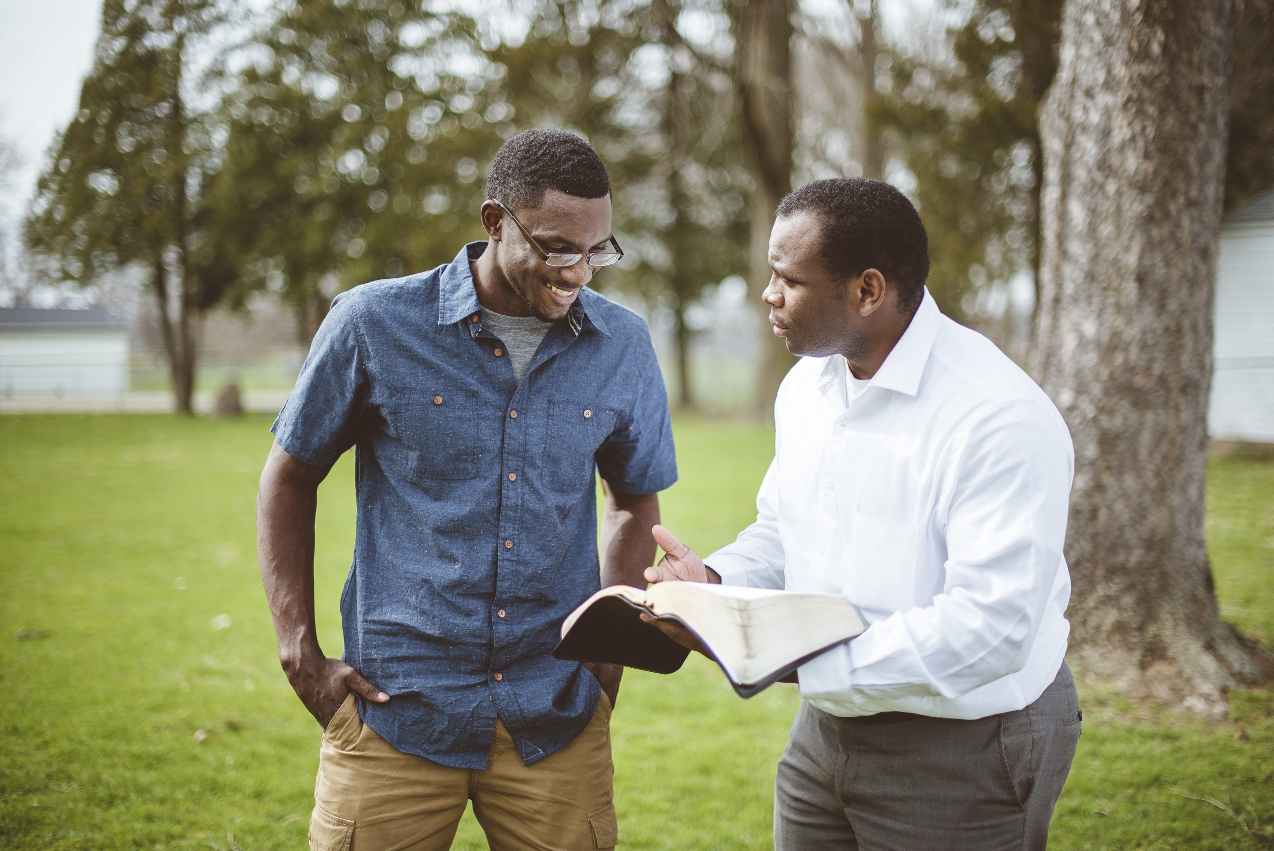 Apostolic Witness Brethren Standing in Park Discussing the Holy Bible